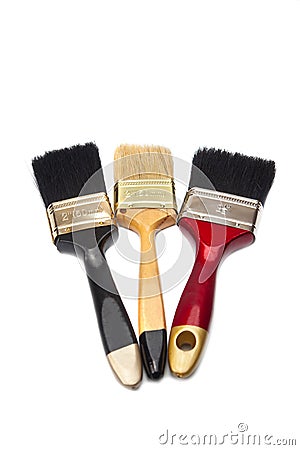 Three paint brushes of different colors Stock Photo