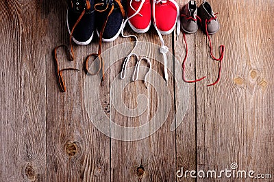 three pair of shoes representing family, growth, education and togetherness concept Stock Photo