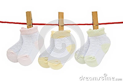 Three pairs baby socks hanging Stock Photo