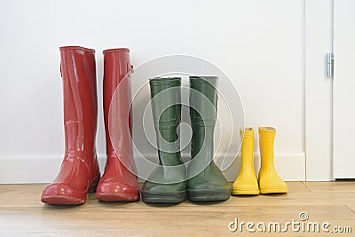 Three pairs of colorful wellingtons Stock Photo