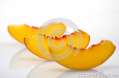 Three peach slices with reflection Stock Photo