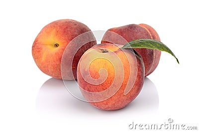 Three peaches with leaf isolated on white Stock Photo