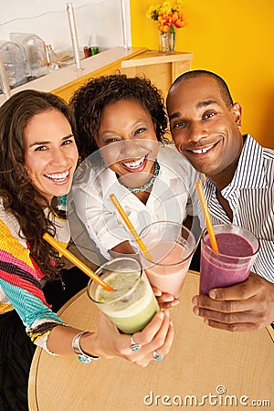 Three People Dining Out Stock Photo