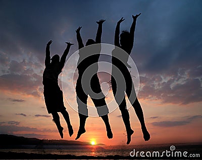 Three people jumping Stock Photo