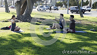 Three People in Practice Yoga Editorial Stock Photo