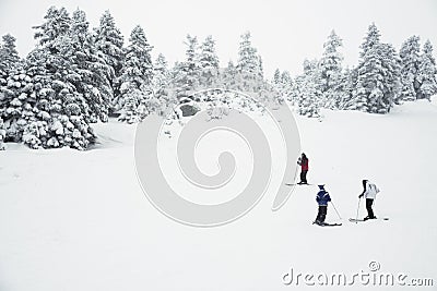 Three people skiing on the mountain Stock Photo