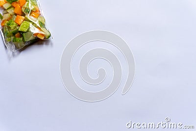 Three plastic bags of pickles made from cucumber and carrot on a white background Stock Photo
