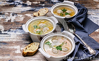 Three plates of vegetable soup with meatballs. Cabbage, potatoes, carrots and meatballs Stock Photo