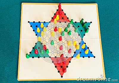 Three-player gameboard of Diamond Game on table Stock Photo