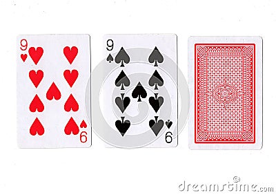Three playing cards with a pair of nines revealed. Stock Photo