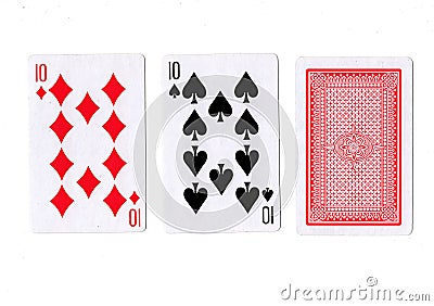 Three playing cards with a pair of tens revealed. Stock Photo