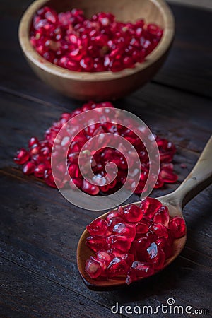 pomegranate with bowl on real wooden table Stock Photo