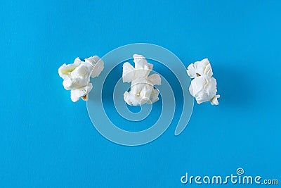 Three Popcorn on a bright blue background, design concept Stock Photo