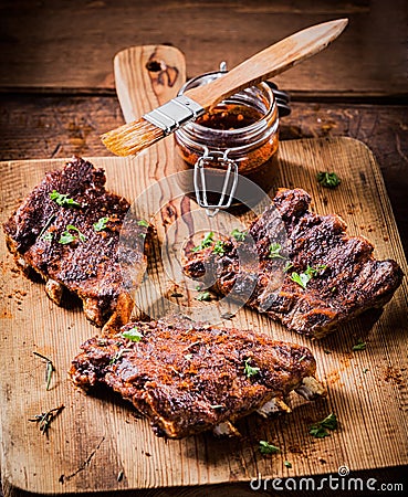 Three portions of spicy grilled ribs Stock Photo