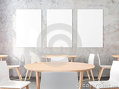 Three posters on concrete wall in cafe interior Stock Photo