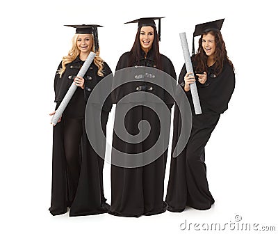 Three pretty female graduates smiling happy Stock Photo