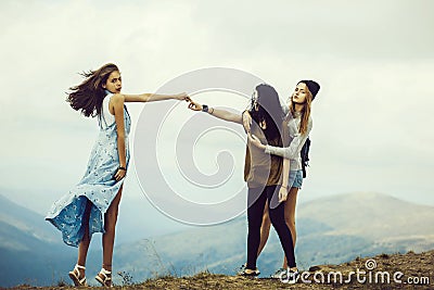 Three pretty girls on mountain Stock Photo