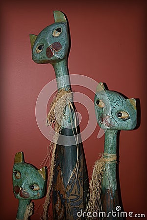 Three pretty wooden cats Stock Photo