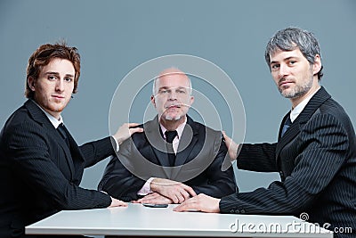 Three proud business partners posing together Stock Photo