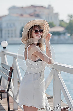 Three quarter length portrait of long-haired blonde woman in hat Stock Photo