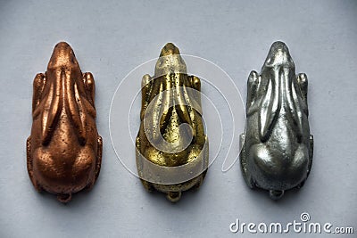 Three rabbits of copper, brass and aluminium Stock Photo