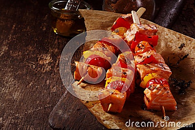 Three Raw Fish Kebabs on Table with Oil Stock Photo