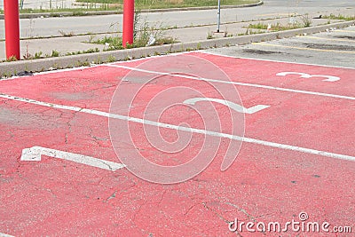 three red parking spots spaces with numbers 1 2 3 in each of them side by side. p Stock Photo