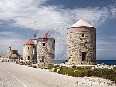 The three Windmills of Mandraki Harbour in Rhodes Greece. Stock Photo