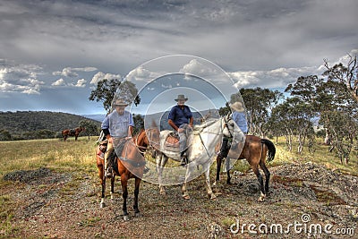 Three riders rider on a mountain Stock Photo