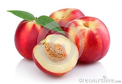 Three ripe peach (nectarine) fruits with slices Stock Photo