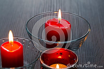 Three romantic candles in close-up. Home decor items. The light of the fire of paraffin candles Stock Photo