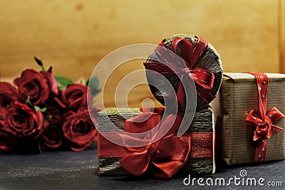 Three romantic gift boxes and red roses Stock Photo