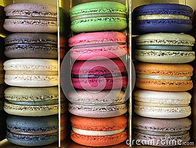 Three rows of colorful macarons (macaroons) french dessert in a box. Stock Photo