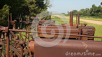 Three Rusted Antique Tractors in a Row Editorial Stock Photo