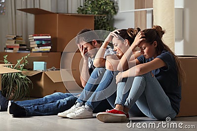 Sad evicted roommates moving home complaining Stock Photo