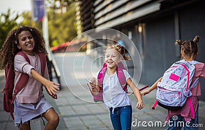 Three school girls outside Happy kids Stock Photo