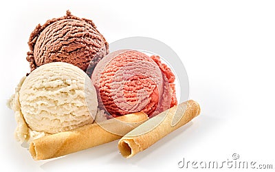 Three scoops of ice cream with wafer rolls Stock Photo