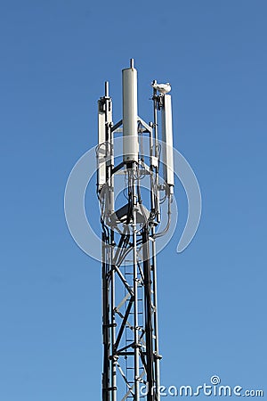 Three-sector mobile telephone base station on lattice girder tower Stock Photo