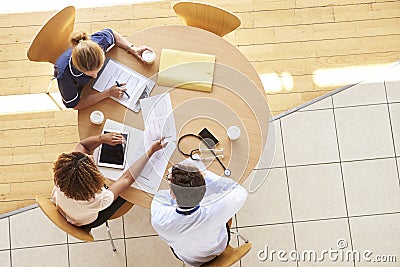 Three senior healthcare workers in a meeting, overhead view Stock Photo