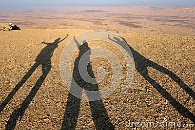 Three morning shadows in the desert. Stock Photo