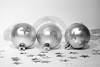 Three silver christmas balls with ribbon Stock Photo