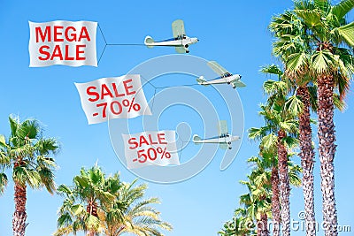 Three small aircraft towing banners with SALE Stock Photo