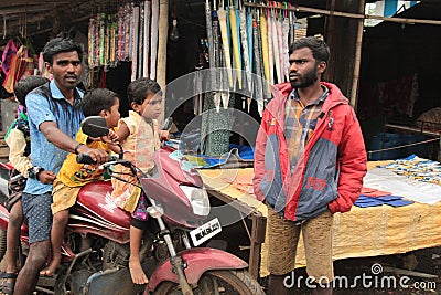 Three small children on a bike Editorial Stock Photo