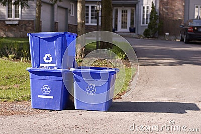 Three small recycle bins on curb Stock Photo