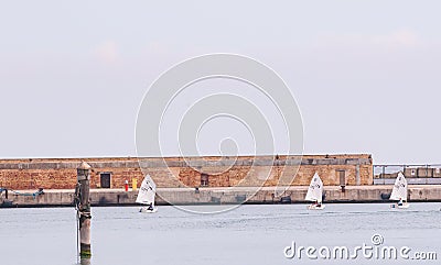 Three, small, sailboat with young captains, racing into the Adreatic sea Editorial Stock Photo