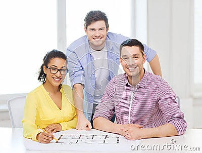 Three smiling architects working in office Stock Photo