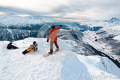 Three snowboarders are having a rest Stock Photo