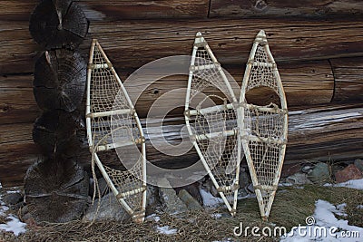 Three snowshoe at the wall of the wooden house Stock Photo