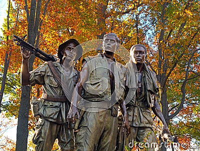Three Soldiers at the Vietnam Veterans Memorial Editorial Stock Photo