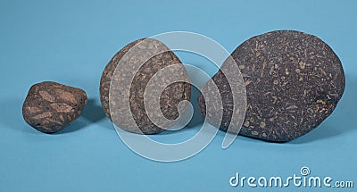 Three specimen of Rhomb-porphyry stones. Stock Photo